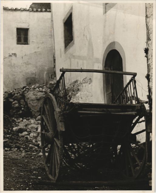 The cart in front of the farmhouse door